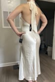 I purchased this dress for my elopement and it is so pretty! My only complaints are that the fabric lays weird on the butt due to how it was sewn. The fabric is also not very thick and somehow the seam came apart in-between me trying it on once and me wearing it for my elopement. Otherwise, it was comfortable and photos came out well! Side note that it is not as white as the photos, but I think the color is perfect. - Emily C.