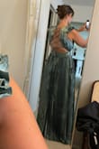 The top of the dress is beautifully designed. The adjustable back allows for the option to tighten or loosen the top as needed. I'm bigger chested and it fit great, holding me in nicely. I am returning because of the bottom of the dress is so uneven and poorly cut. I am tall, so I don't need to get it hemmed but the length is 3" off the ground in the front and trails longer in the back. Really careless cut. - Devan P.
