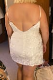 The wrap part in front would cover a tummy well but it runs small, I'm mostly XL in most brands and a different Lulus dress fit in XL so this dress just is tight so size up. Also no wiring in the cups on the chest. - Erin H.