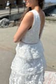 Married for four years with a kid, wanted to do the church wedding during summer - perfect choice. White, dressy, not too wedding-ly, and can wear in the future for other occasions! I'm usually size xs for all the tops and xs/s for bottoms. I used the suggested size chart and ended up buying size s which was a bit loose on me. Xs would have been better but I didn't want the exchange hustle. - Olha S.