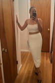 Bought this two piece for a night out, and I loved the way the back looked. The top is tied in a way that secures the girls, which I appreciate. The only thing I didn't love was the zipper in the back, it protrudes slightly... But overall great buy, can wear the pieces separately too and it can be dressed up or down. - Iona B.