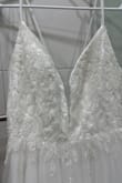 I love it! It was my favorite dress out of all I tried for my wedding. For me was a little tight but the next size was out stock, so I keep the 6 and it worked out great! A lot of compliments, looks really high end couture, nice details, and perfection. Thank you! - Mabel A.