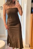 Definitely appears long on me being 5'3". It fits my boobs right. I'm a 34C, but I got a dress in the mail with black marks. - Kacie H.