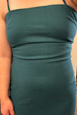 This green dress is very pretty. It is a little tight on me around my bust, and I probably could have sized up, but I could still zip it up all the way. The big issue is that there was something snagged in the middle that ended up with a visible line going down the dress. There is no way I could wear this out. It is so obvious, and unfortunately, I can't return it or exchange it. - Mayu O.