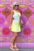 I wore this dress for a fun day in Las Vegas on my birthday. I loved the style and the fact that it was lined. It was just the right length to show off my legs, but not be too short. It definitely runs big! I should have ordered an XS, but according to the Fit Finder, I was a S. I did not take the time to exchange it. Also, the fabric wrinkles very easily! I did a lot of sitting, and the creases across the middle were pretty bad. One photo is before sitting, the other is after sitting in an Uber and at some slot machines. I may have it altered to fit a little better, and will probably only wear if I know I will be standing most of the time. - Andrea W.