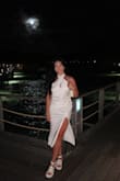 I absolutely fell in love with this dress the moment I tried it on. The open back, slit on the leg, and the tighter fit make this dress look absolutely amazing! I received so many compliments about this dress both at my bridal shower and on my honeymoon. I am finding any excuse to wear this dress again! - Alejandra S.