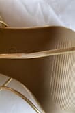 Shoes run a little big. The straps are peeled and the color coating has come off in many areas of the straps. Ordered these shoes and a dress for a wedding and both items arrived damaged. - Yolanda V.