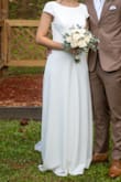 I bought this dress on clearance for my intimate wedding, and it was perfect! So elegant and it fits just right. I only had to hem it, but I also decided to take in some of the sleeve so it wouldn't flare out so much. - Michelle N.