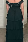 I absolutely love this dress I got a size large and it's just a little bit big but a medium would've been too small. It's very nicely made. I am planning to wear to a wedding and I think it'll be perfect. It's also perfect length and I'm 5'9 - Kaelyn V.