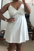 This little slip is absolutely adorable and exactly what I was looking for for my wedding getting ready outfit! Thankfully other brides had reviews with pictures, so I was able to decide on the Large, which fits great! It doesn't hug the body, and flows just right. I thought it would be a silk material, but it's actually a super soft cottonish fabric, which I like. Can't say I truly think it's worth $50 considering it is a teeeeeny bit see through, but I can't complain, I do love it. The lace at the top is very bridal. The adjustable straps help to get my boobs sitting in the right place. I do have a larger chest as a 38D, and really love the look of it. It's not one of those styles where if your boobs don't fit in the "slots" it looks weird, it is actually really flattering on small and large chests I think. I'm 5'2 so the length is great for me as well, but I could see it being short on a taller woman. Overall 10/10 for me! I'll pair it with a white robe and some white slippers for the big day! - Zafyre S.