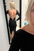 I loved this dress. I bought 7 dresses and this was in my final 2. The only reason I didn't pick it was because it was a heatwave at the wedding and the fabric on this dress is thicker....so long sleeves, black, outside wedding-- just didn't work well... BUT this dress is very stunning on... the back sells the entire dress.... the front was a bit plain but the back was so perfect so I bought it to wear at another event hopefully. It is really tight... but I think it has to be of the nature of the dress. the back of the dress does have metal "boning" in it to help keep its shape.... just be aware of that if you don't like the under-wire feel....I kept it even though for the event it didn't work... but still hopeful to wear it soon! - Rebecca B.