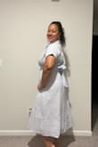 I'm surprised this dress fit me in a Medium. Based on the reviews, I decided to size down and so glad that I did. This fits perfectly! Love the style, the fit, and the pockets! - Brigitte S.