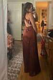 I bought this as a bridesmaid dress and I am so in love with it! The quality is great, it feels much more expensive than it is. Fits true to size, maybe a teeny bit long but works great with heels. - Ava P.