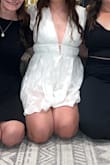I wore this for my bachelorette. I usually wear a medium and this fit perfect. I have a long torso so I usually can't wear rompers because they are always too short or constantly ride up. I didn't have a problem with this one at all. Super comfortable and cute! I am smaller in the bust so when sitting down the shoulders did want to fall down a little bit. - Mandy C.