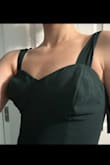 The dress is super cute except for the bust! They are weirdly large and pointy and I couldn't make it look normal regardless of the bras I tried and couldn't fill out the top even with two bras. I ordered an xs and it fit great everywhere except for the chest so that was really disappointing. I guess this would probably work better with someone with a larger chest. - Ally T.