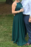 I wore this as a bridesmaid in my best friends wedding. I was beautiful and I received a lot of compliments on it! I had cups put in since you can't wear a bra. I am 5'5 and the length was perfect on me. I wore flats with the dress. Just a little long which I would prefer. - Candace R.