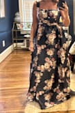 The dress is stunning for a fall wedding but I couldn't zip the back over my chest. I hate it because a larger size would have been far too large everywhere else. - Lesli M.