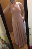 This dress is exactly what I though it would be. I wasn't my choice to get this dress since I'm a bridesmaid. It's a pretty dress. The material is thick and stretchy. But shows everything. Now I need to work out and tone up so I don't look bad in the dress. It fits perfectly. My problem with the dress is that no matter how you put it on and use it I think it just looks meh/blah. I'm not sure why it has amazing reviews honestly. And since the dress shows everything idk how to wear it without my bust showing through and it needs to be appropriate for a wedding. - Jasmine P.