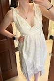 I'm too pale for white dresses; it is def NOT my color. But I think it fits okay. Could be better but oh well. I think since it's 100% cotton. I am going to tie-dye it and see how that goes - Sydney V.