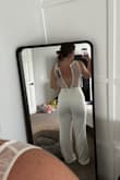 It is of great quality! I love the look and the fit, not restricting. The only issue I have is that there's no support for the chest. It would be best with heels, the length really allows for that. Potential to get it hemmed if not! - BOBBI S.