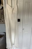 I will like to change for biger size is too tight from the bust to waist - Monica M.