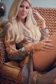 This outfit is absolutely gorgeous with the earth tone colors and its super sexy yet classy with the sheer drape. The breast area could use a bit more coverage so be prepared to show alot of cleavage.  I love it though. Recently wore for a photo shoot. - Leah V.