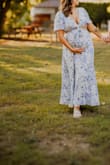 I sized up for maternity pics (normally a medium), and this dress was PERFECT! - Sydney E.