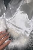 Opened package at my bachelorette to wear, 4 buttons feel right off. None of the buttons are even sewed on at all. The bottom of the pant fur wasn't sewed on properly either, and my foot got caught in it. I feel and bruised my knee. Horrible experience. - Sandra M.