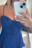 Wanted to love this dress and wear it to a wedding in the beginning of October, but the quality was just not there with this item. I'm surprised because I usually love everything I get from Lulus, but they dropped the ball on this one. The pleading on the front of this dress is messed up, looks like they may have put too much fabric? It also bunches in the back. I also bought the full length light blue version of this dress, and it is much better quality, you can see the difference in the pleading on the top. The zipper on this dress also came pretty shredded up as you can see in the pictures. Will be returning this one, but keeping the full length light blue! - Allie S.