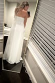 It is a beautiful dress. Way too long for me because I'm 5'3 but I will get it hemmed. I bought it for my courthouse wedding. I also like it better with the straps tied around my neck. - Stephanie M.