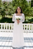 I immediately fell in love with this dress when I saw it for my civil wedding. The bust area (I'm a 38 DD) and sleeves fit perfectly, however, it is a bit long so I had to hold it up while I walked with platform heels. - Michelle C.