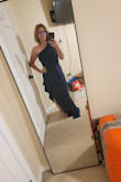 I LOVED this dress. It was so comfy and sexy and beautiful. I think it's ALL THE WORDS. I wore to a wedding and it was great for dancing. The material offers some stretch. It was slightly long on me even with heels so I had the bottom hemmed. The first photo is after alterations and the second was straight out of the shipping bag. I would highly recommend this dress for any dressy occasion. I could have probably done down to a small but didn't want to risk it. I will say because of the layers you're better off not wearing shape wear because it can bunch up a bit. I ended up taking mine off mid-reception. The color is gorgeous as well. I just love it. - Ashley P.