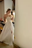 I'm 5'6 142-145lbs and it fits like a glove. I got a size 6 and it's a little tight but I would rather have a strapless dress tight than loose. - Heather N.