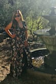 Has a long string inside that, allows you to wraps around your body according to how you liked it fits you. Plunging neck line makes it really sexy yet classy! Has a slight that breaks the flowy long dress that adds more flirtiness and drama! Love it! - Melody M.