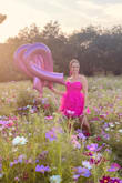This dress caught my eye the first time I saw it! I was looking for a short dress that wasn't too revealing or too tight. I love the tutu material! You can also adjust the straps. It's incredibly comfortable too and not too short! I wore this for a breast cancer survivors photo shoot. Paired it with pink converse sneakers. - HOLLY S.