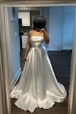 I bought this with high hopes and it definitely delivered. The dress is absolutely beautiful. Everyone thinks I look like a princess. The quality is absolutely shocking for the price because it is such good quality. I barely have to make alterations but because I'm 5'2 and I just have to trim off a bit. Wasn't a fan of the bows so I took those off. Overall, it's amazing I won't shut up about how great it is.
The dress is timeless because it is very elegant and classy. It it has a shine to it. - Julie L.
