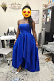 I needed a royal blue dress for my best friend's wedding. I knew I wanted strapless and possibly a high/low hemline. This dress was perfect. Since I had to get about 18 inches cut off (I'm 5'1 and heels were 3 inches) I had the seamstress cut the front into a high/low. I REALLY LOVE this dress. The fabric feels good on my skin. Other reviewers mentioned the zipper being faulty. My seamstress said most dresses with this type of waist are difficult to zip by yourself due to the zipper going in a slight angle as it goes up. Once she showed me how to grab the sides of my "natural" waist and squeeze going backwards, she zipped the dress up smoothly. Nothing is wrong with the zipper, you just need a person to zip you. This was a great purchase for me. - Roshonda M.