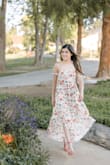 I purchased this for my college graduation and I wasn't disappointed at all. I took my graduation pictures in it as well. My body type (and chest) are small so I didn't have complaints about the dress falling. The sleeves didn't dig in and the sides have elastic that stretches and hugs you to keep the dress up. The slits ran a little higher than I thought so I'd wear shorts if it's windy and you're taking pictures. I had my gown on so I wasn't too worried but it was windy when I took pictures so maybe wear a safety pin somewhere if that's the case for you. Overall, I'm happy with this purchase! - Hailee S.