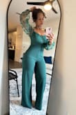 This jumpsuit was a hit at the wedding. I received so many compliments. The fit was true to size. I have a pear shaped build and the stretchy fabric fit beautifully. - Neke C.