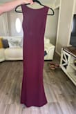 It's a beautiful dress, fits snugly to the body and accentuates the silhouette. The fabric quality is perfect, and very strong with impeccable finishing. I didn't need to make any alterations. The color is lovely, somewhere between plum and burgundy. - Marianny M.