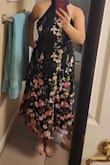 The dress is really cute in person.  It fit nicely on me and I had issues with multiple dresses and my chest. The back is sheer on the top with a cute bow, which is really cute. - Dusty G.