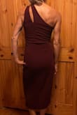 This dress fits wonderfully. Great stretchy material and fairly lightweight, very forgiving for any self-conscious curves, but also very flattering. Only issue I have is a zipper is very difficult to move up or down past the seem. - Christy L.