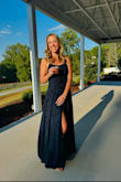I bought this dress to wear as a wedding guest and I loved everything about the fit through the shoulders and waist but it was unfortunately insanely long! I didn't have time to have it hemmed before the event so I had to pin it up with safety pins. It's a gorgeous dress though and I got lots of compliments! - Rachel C.