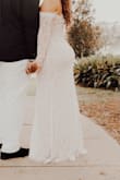 I'm so in awe of this dress, I got a ton of compliments and I felt so confident in it as well. It fit great and it flowed well. My only two comments to note: 1. When first putting sleeves on it was hard and can't move your arms up in the dress, I recommend having someone help you get into your dress. 2. The breast area is not cupped, I didn't really fill out the breast area in the dress and some pictures look flat there because that's how the dress is. Overall I'm super happy with the dress and how it turned out. - Tavey L.