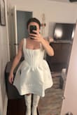 This dress is ABSURDLY wide and poofy. I ordered a small and the top part fits tight enough but the sleeves are too long and fall off. And the hips. THE HIPS! Please see pics. I look like an exploded marshmallow. Immediate return. :( - Carmen G.