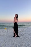 This dress is perfect and I can't wait to wear it again! The material is thick but wasn't too thick for a beach wedding. The neckpiece is EVERYTHING. I was told that I looked like a vampire, that I looked like Mrs. Smith, and that I looked like a high fashion model. Not just gassing myself up! This dress is everything. The bust was slightly loose, but I have itty bitty titties so that wasn't a shock.

Size S was perfect; XS would've been too tight and form fitting. - Lauren D.