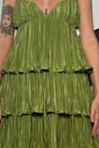 I almost ordered a medium and glad I didn't. The dress was very loose around the top and didn't flow the same as the photos. I wouldn't size down because it would then be too short. Looked fine taking a photo but felt so loose - Caroline W.