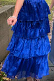 I was really happy with this dress! I got so many compliments! I love the shininess/slight reflection the material gives off. It's kind of noticeable in the pictures, but it really comes through in person/in natural lighting (the second picture shows that well). I really liked the fit of the dress too. I was looking for a full length dress, but since I'm on the shorter side (5'4) I decided to look at "midi" length dresses. This one was the perfect length - right to my ankles. The positioning of the bust was also really ideal. The skirt starts kind of right under your bra line, which is nice so you don't feel suffocated lol - especially if you're someone who bloats easily. Overall - 10/10 purchase!! - Abigail S.