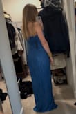 This dress isn't very flattering and did nothing for my body. I'm an S and based on reviews I ordered an XS which ended up being the perfect size, however, the shoulder area was way too tight and I can imagine it becoming uncomfortable. The dress didn't accentuate my curves and was still dragging on the floor even when I put heels on (I'm 5'3"). Like other reviews said, the stitching gets a bit lumpy in some places. Has a lot of potential to be a beautiful dress if it was made slightly different. - Heather C.