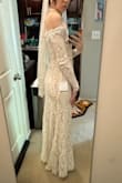 Bought as a possible wedding dress. The dress fit pretty well but the sleeves were a little too tight. Didn't like that I couldn't raise my arms. - Jerika S.